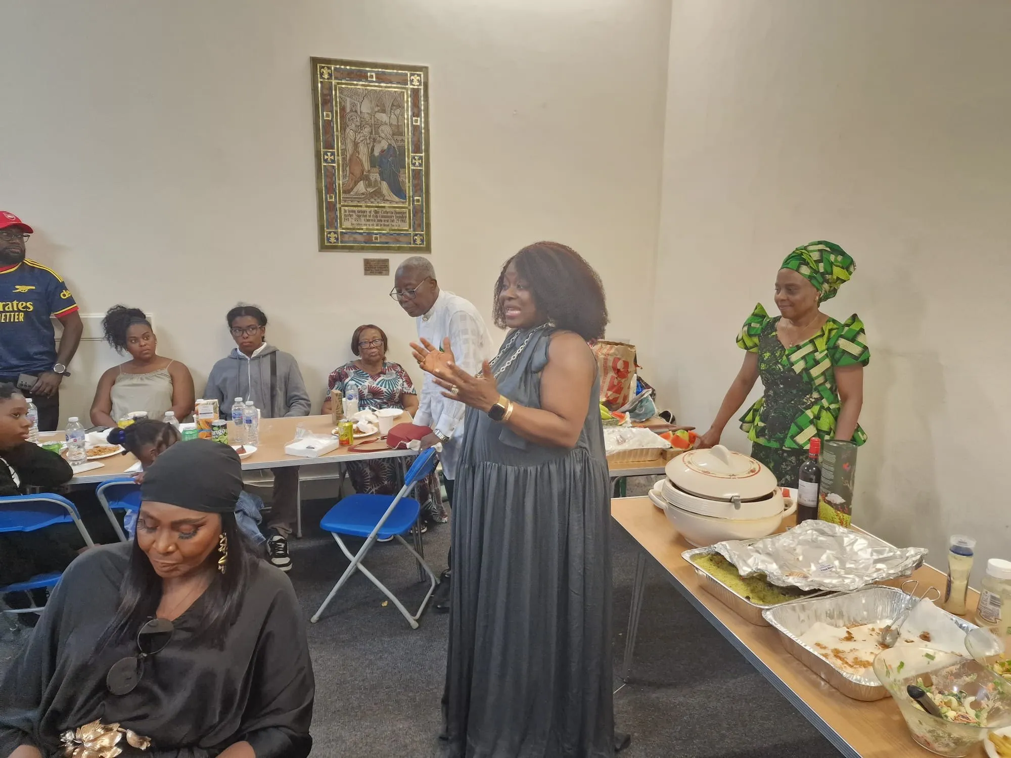 A member addresses the gathering in the church hall